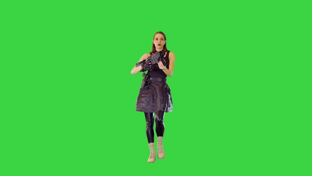 Anime-character girl in military clothes walks with machine gun on a Green Screen, Chroma Key.