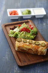 Mexican Burrito with salad and sauce 