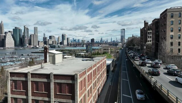 Cars Headed To Manhattan Skyline In Dumbo Brooklyn Colorful Water Tank Watertower New York City