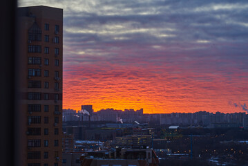 Fototapeta premium Urban landscape. A bright sunset over a winter city.