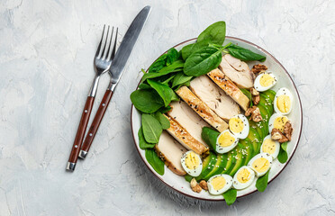 keto diet salad avocado, grilled chicken fillet, quail egg, spinach, walnut. Healthy fats, clean eating for weight loss, banner, menu, recipe place for text, top view