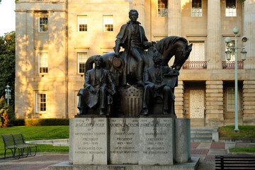 Three North Carolina-born U.S. presidents: James K. Polk, Andrew Jackson, and Andrew Johnson, outside the state capitol in Raleigh, North Carolina, USA.