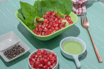 Healthy food vegetable salad in green bowl on background.