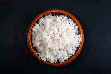 Rice white in bowl on wood table Asian healthy food.