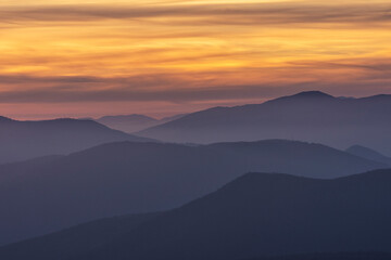 Obraz premium Beautiful colors of nature after sunset over foggy Old mountain, Bulgaria. Landscape, travel concept. Close up view.