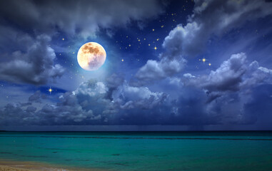 Night stars sky and full moon on Caribbean sea.