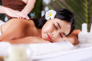 Fototapeta na wymiar close up beautiful young asian woman lying relaxing in the spa salon massage