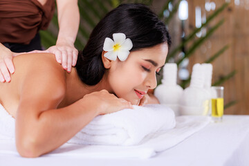 Obraz na płótnie Canvas close up beautiful young asian woman lying relaxing in the spa salon massage