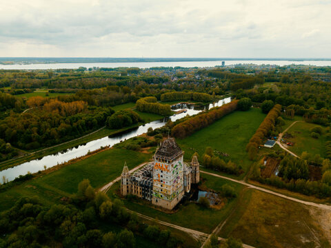 Aerial drone view of the landscape in Almere, the Netherlands that reveals the modern ruin of Castle Almere.