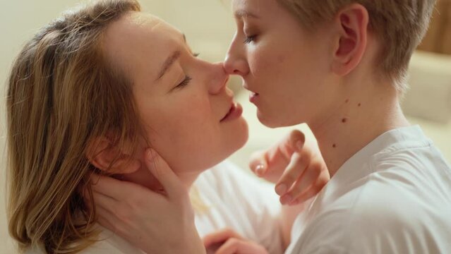 two beautiful women. lgbt couple, tenderly kissing love relationship, happiness