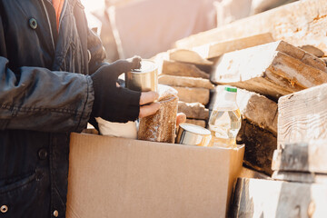 Concept humanitarian aid community charity donations center with sunlight. Homeless refugee is...