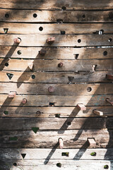 Wooden wall climbing with shadow in evening.