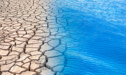 Cracked soil in blue water