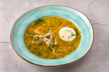 Soup soup on chicken broth with vegetables. Half an egg