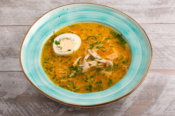 Soup soup on chicken broth with vegetables. Half an egg