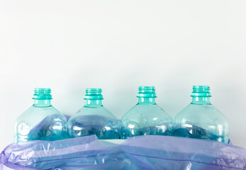 empty bottles of water in trash bin