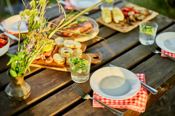 Served with plates dinner table, summer picnic outdoor at home backyard on fresh air, appetizers...