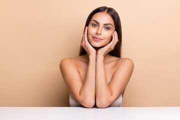 Portrait of attractive sweet girl touching face enjoying healthy life medicine concept isolated over beige pastel color background