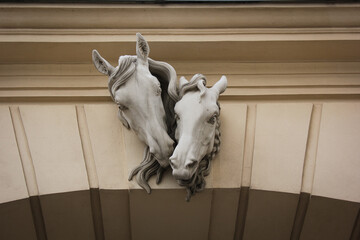 Facade wall with horses heads sculpture