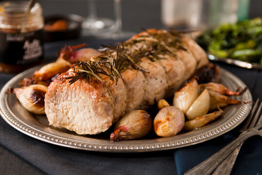 Rosemary Pork Roast with Grilled Onions, Broccoli Rabe and Chutney.