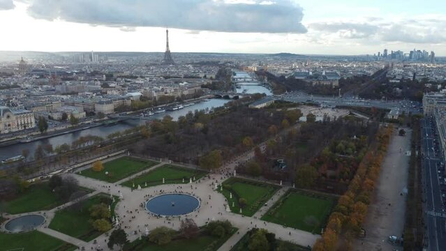 Drone view of Tuileries Garden and Seine River in November with people walking