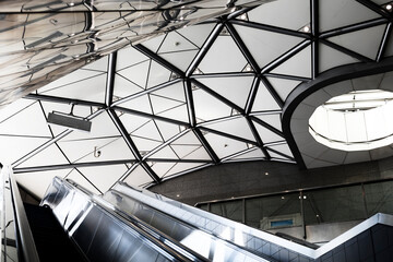 Modern architecture, metal architectural structure. The construction of metal and glass on the facade of the building.