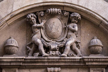Munich, Germany -April 27,2022: Details of stone ornaments on the facades of baroque buildings in the German city Munich which is the capital city in Bavaria.