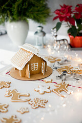 Christmas gingerbread house and baked cookies