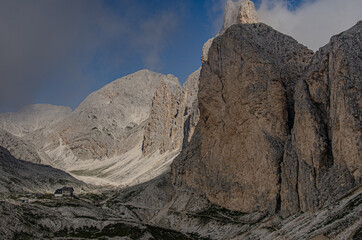 Antermoia refuge, a mountain hut located in Vallon d'Antermoia [valley], in a stony, moon-like...