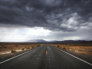 Storm clouds looming over the remote desert, above State Highway 266.  A desolate route of vast...
