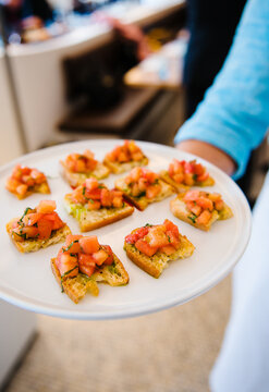 bruschetta hors devours being served at an event