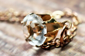 Gold pendant with a large diamond, macro