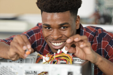 close up of happy man working with pc cables
