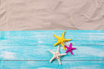 Fototapeta na wymiar Sand copy space. Sand background top view. starfish on wooden background