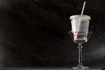 Fototapeta na wymiar Empty coffee cup in a glass on marble texture background