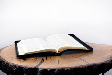 Bible. Open bible on the table. Holy. Book on a wooden background. Scripture, Gospel.