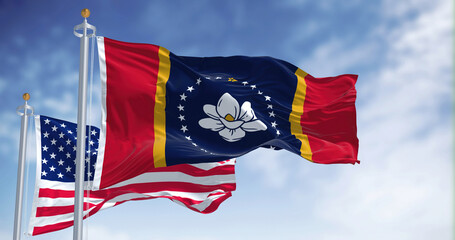 The Mississippi state flag waving along with the national flag of the United States of America