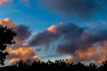 Cumulus and Stratus clouds in dramatic sunset sky over Cape Town