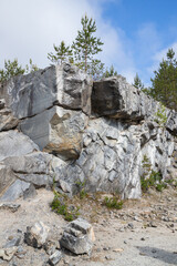 Fototapeta na wymiar Landscape of former marble quarry on a summer day