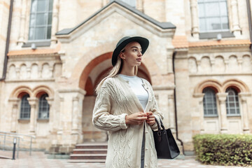 Fototapeta premium Young fashion woman spends time in the city. Lifestyle