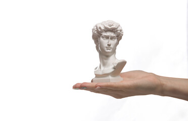 David bust on female hand palm isolated on white background
