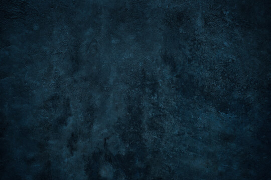 Blue green grunge background. Toned stone wall surface. Close-up. Dark background with space for design.