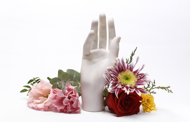 Hand stand with many flowers isolated on white background. Beautiful aesthetic still life