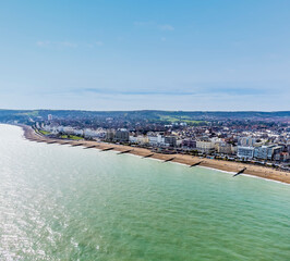 An aerial panorama view west along the seafront at Eastbourne, UK in springtime