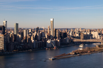Aerial Midtown Manhattan New York City Skyline along the East River with Roosevelt Island and the Queensboro Bridge