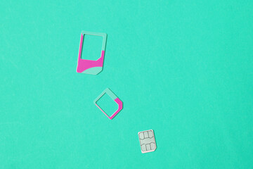 Sim cards on blue background. Top view