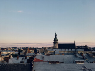 Sep 13 2019/ Lviv. Panoramic view of Lviv from the roof top. Sunset in the city. Travel photography in Europe. Old historical buildings landmarks and blue purple sky at sunset dusk.