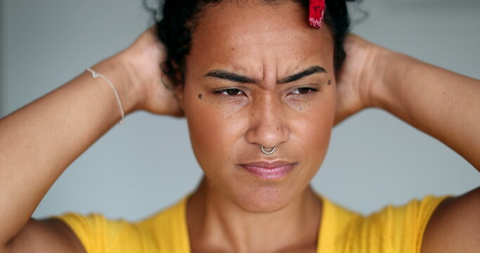 Stressed young black woman. Afrtican girl concerned expression face