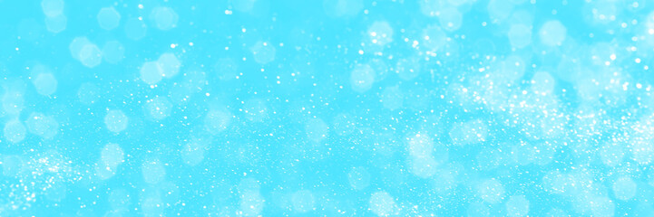 Bright blue sparkling glitter bokeh background, banner texture. Abstract defocused lights header....