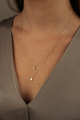 women's gold pendant around the neck of a girl, women's jewelry, pendant with stones, women's...